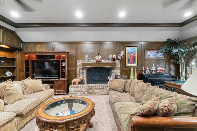 living room with carpet, ornamental molding, a brick fireplace, and built in features