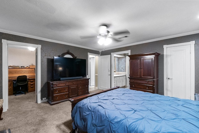 bedroom with visible vents, connected bathroom, ceiling fan, crown molding, and carpet flooring