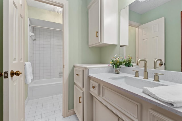 full bath with washtub / shower combination, vanity, and tile patterned floors