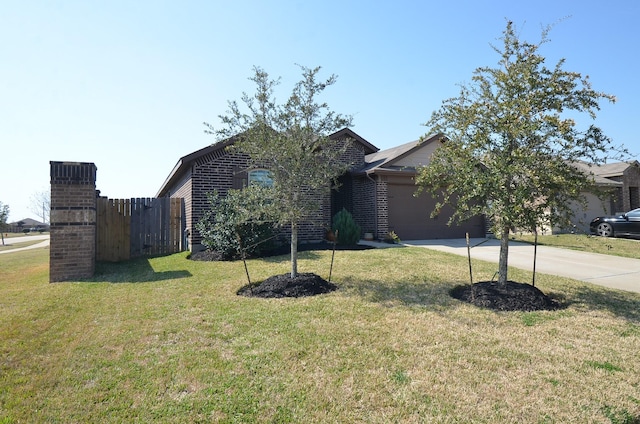 single story home with brick siding, concrete driveway, an attached garage, a front yard, and fence