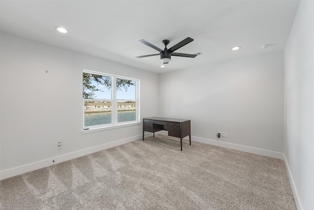 carpeted empty room featuring ceiling fan, baseboards, and recessed lighting