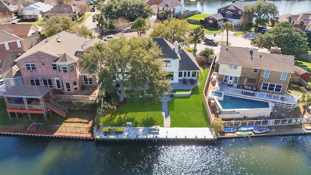 bird's eye view with a water view and a residential view