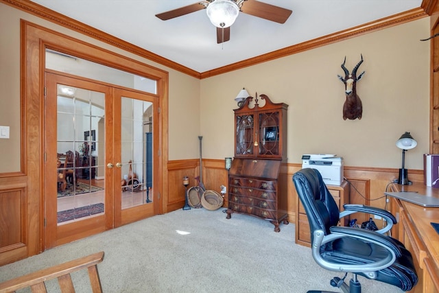 office space featuring a ceiling fan, wainscoting, ornamental molding, carpet, and french doors