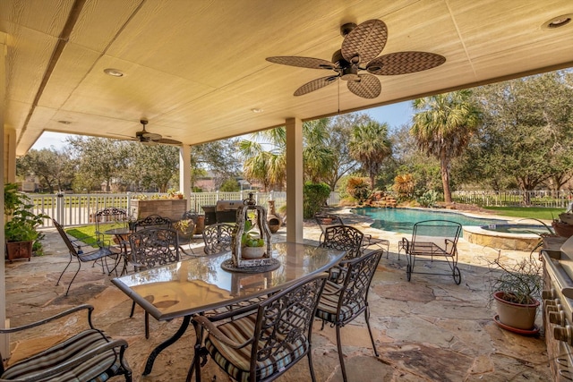 view of patio / terrace with ceiling fan, a fenced backyard, an in ground hot tub, a fenced in pool, and outdoor dining space