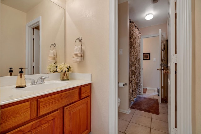 full bath featuring a shower with curtain, vanity, toilet, and tile patterned floors