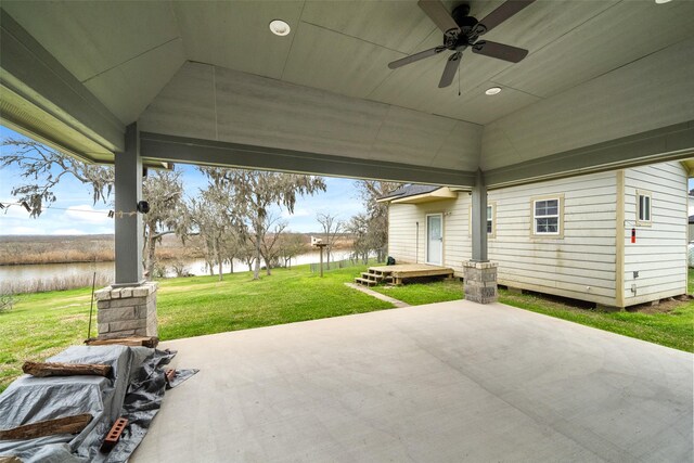 8133 N Fm 565th Rd, Baytown, TX 77523 - view of patio with a water view and a ceiling fan