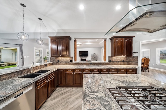 8133 N Fm 565th Rd, Baytown, TX 77523 - kitchen featuring a sink, light wood-type flooring, light stone countertops, tasteful backsplash, and appliances with stainless steel finishes