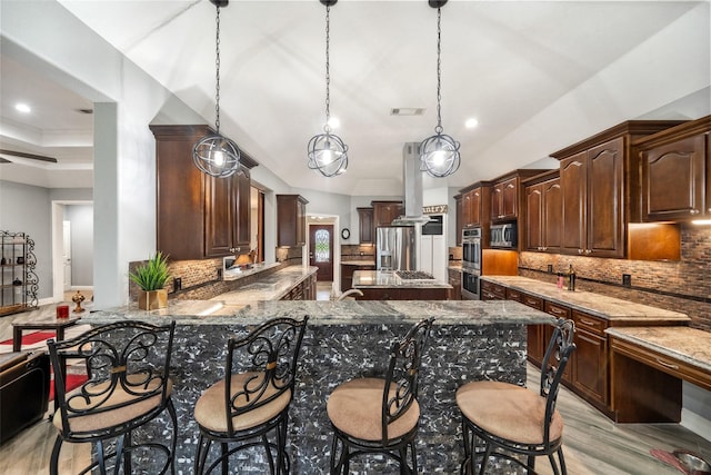 8133 N Fm 565th Rd, Baytown, TX 77523 - kitchen featuring stainless steel appliances, visible vents, dark brown cabinetry, backsplash, and light stone counters