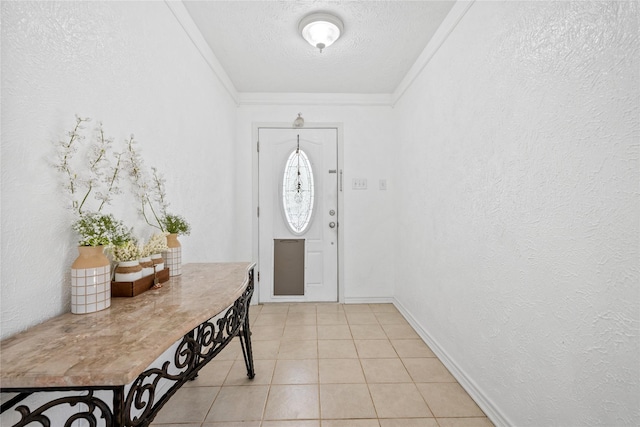 entrance foyer with a textured ceiling, a textured wall, light tile patterned flooring, and crown molding