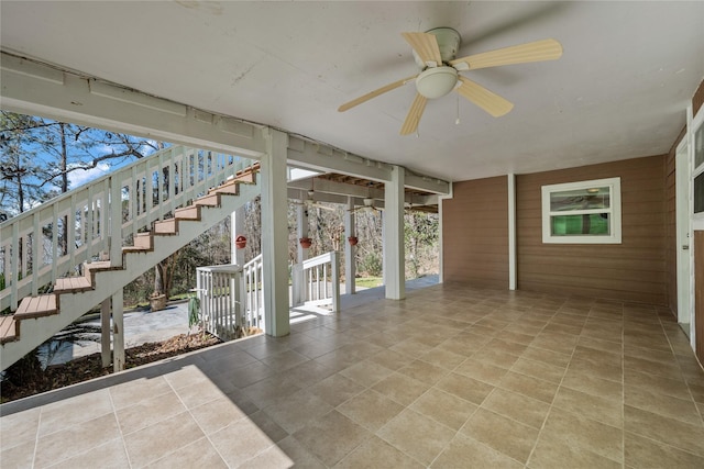 view of patio featuring stairway and a ceiling fan