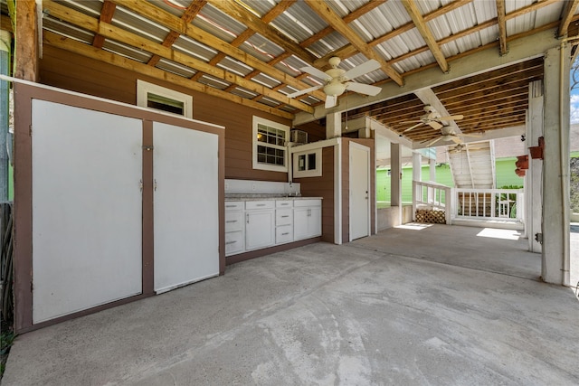 view of patio / terrace featuring ceiling fan and an outdoor kitchen