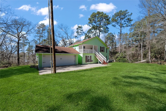 rear view of property featuring a yard and stairway