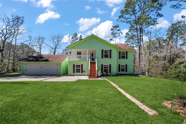 view of front of home featuring concrete driveway, an attached garage, stairs, an outdoor structure, and a front lawn