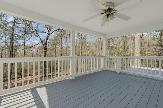 wooden terrace featuring ceiling fan