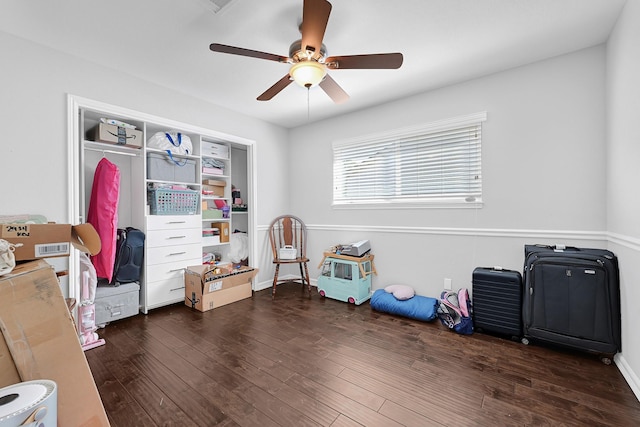 interior space featuring wood finished floors and a ceiling fan