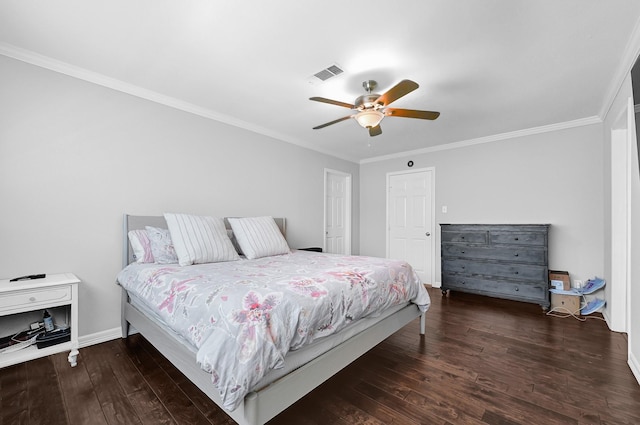 bedroom featuring ceiling fan, visible vents, wood finished floors, and ornamental molding