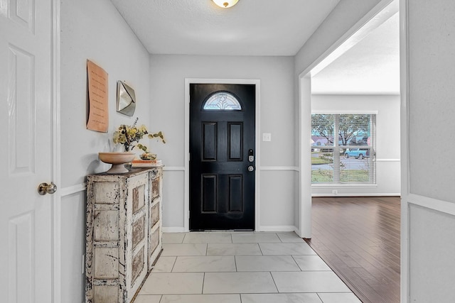 entrance foyer featuring baseboards