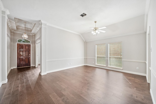 interior space featuring crown molding, visible vents, dark wood-type flooring, a ceiling fan, and baseboards