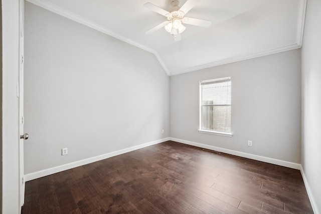 empty room featuring baseboards, lofted ceiling, ceiling fan, ornamental molding, and dark wood-type flooring