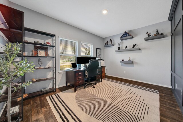 home office featuring baseboards and dark wood-type flooring