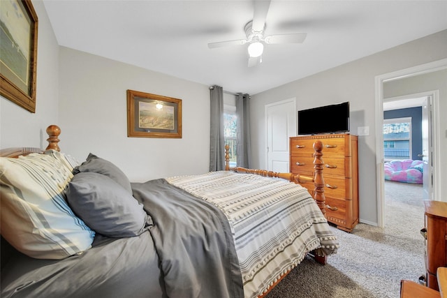 bedroom with light carpet, ceiling fan, and baseboards