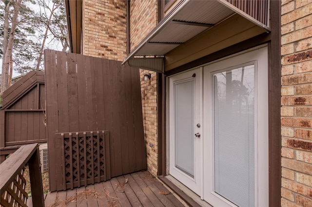 property entrance with brick siding