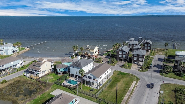 drone / aerial view with a water view and a residential view