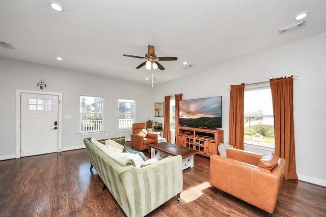 living area with baseboards, wood finished floors, visible vents, and recessed lighting