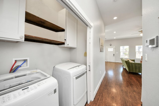 washroom with washing machine and dryer, recessed lighting, wood finished floors, baseboards, and cabinet space