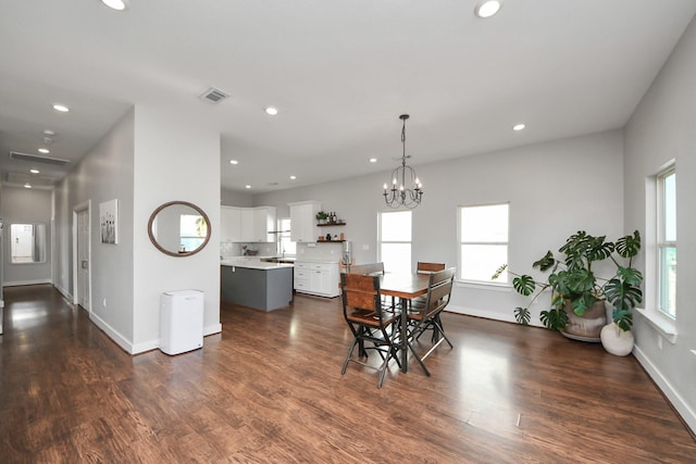 dining room featuring dark wood-style floors, baseboards, visible vents, and recessed lighting