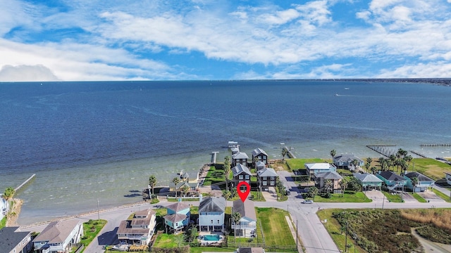 drone / aerial view with a water view and a residential view