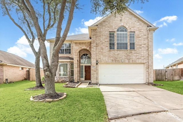 traditional home featuring concrete driveway, brick siding, fence, and a front lawn