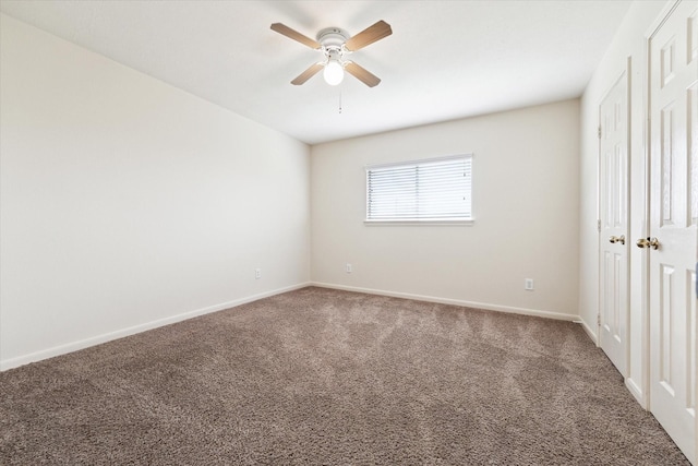 unfurnished bedroom featuring carpet floors, a closet, baseboards, and a ceiling fan