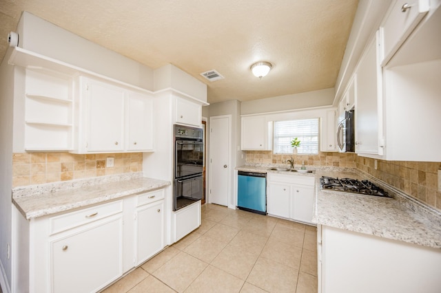 kitchen with visible vents, appliances with stainless steel finishes, white cabinetry, open shelves, and backsplash