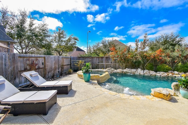 view of pool featuring an in ground hot tub, a patio, a fenced backyard, and a fenced in pool