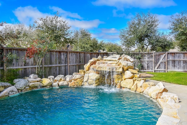 view of pool with fence