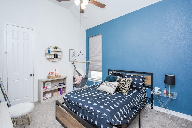 bedroom with a ceiling fan, carpet, lofted ceiling, and baseboards