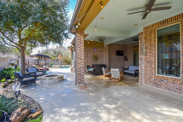 view of patio featuring a fenced in pool, fence, a fire pit, and a ceiling fan