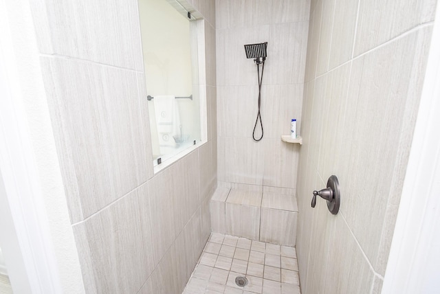 bathroom with a tile shower