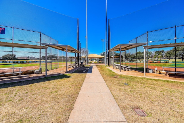 view of community featuring fence and a lawn