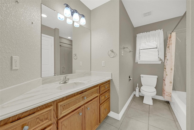 bathroom featuring tile patterned flooring, toilet, visible vents, vanity, and baseboards