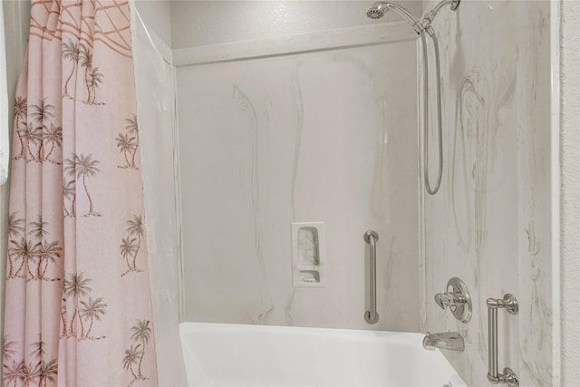 bathroom with shower / bath combination with curtain