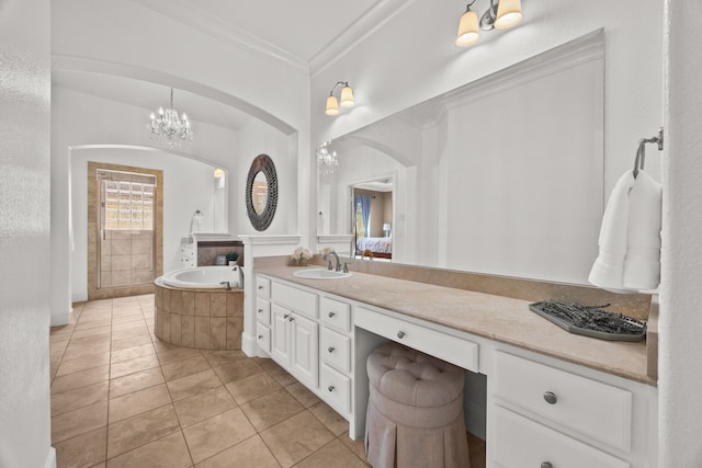 bathroom featuring ensuite bathroom, ornamental molding, vanity, a bath, and tile patterned floors