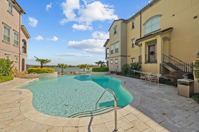 community pool with a patio