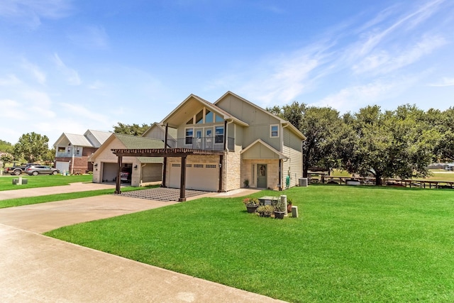 view of front facade with driveway, stone siding, central AC unit, and a front yard