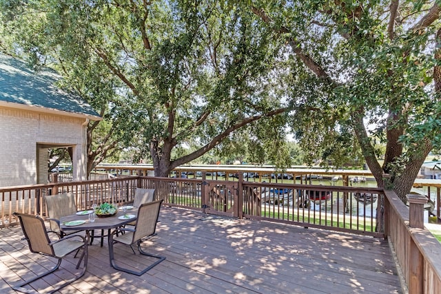 deck with outdoor dining area