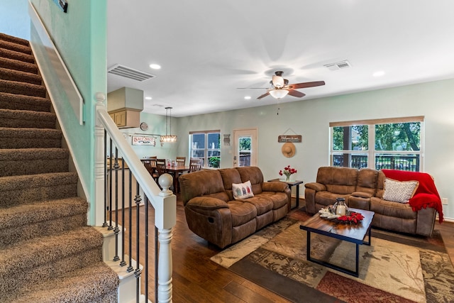 living area featuring stairs, visible vents, hardwood / wood-style floors, and recessed lighting