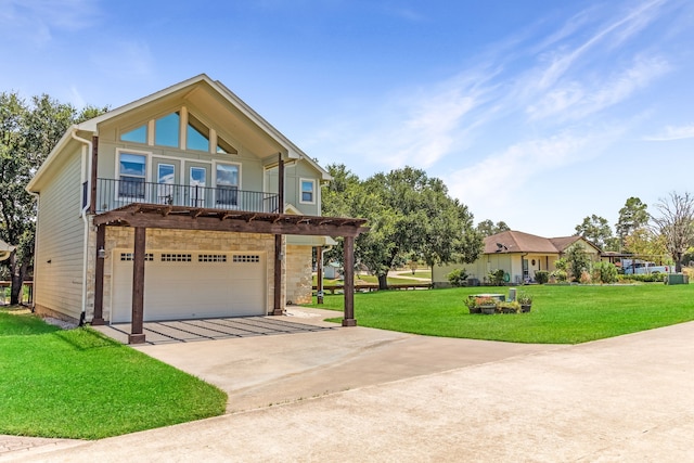 view of front facade with a front yard, concrete driveway, and an attached garage