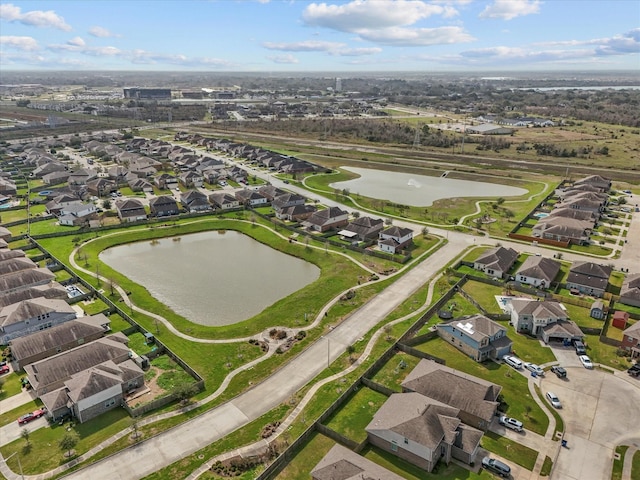 birds eye view of property featuring a residential view and a water view