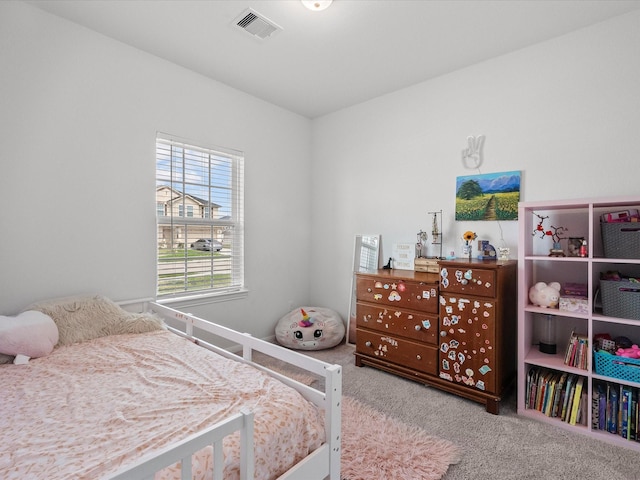 bedroom featuring carpet and visible vents